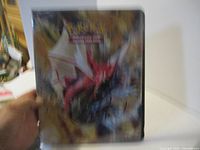 Front cover of the Pokemon Trading Card Game binder with artwork of several Pokemon.