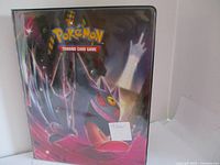 Black Pokémon Trading Card Game binder with Gengar artwork on the cover and label showing '9 Holo'