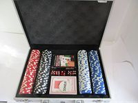 Open case showing poker chips, playing cards, and dice inside