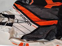 Front view of the zip up hoodie showing detailed 3D printed design with orange, black, white panels, and 'MALIWAN' text.