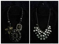 Photo showing two vintage necklaces on black busts; left is a black bead necklace with three distinctive pendants; right is a black chain necklace with clear round stones