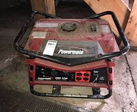 Full front and top view of red open-frame generator in garage.