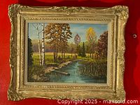 Frontal image of the framed landscape oil painting showing the entire artwork and frame.