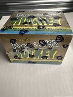 Sealed unopened box of 1992 O-Pee-Chee Premier NHL hockey cards with original branded wrappers and 198 cards noted on packaging.