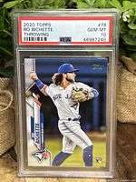 Front of the card showing Bo Bichette in Toronto Blue Jays uniform mid-throw with PSA Gem Mint 10 grading label.