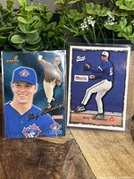 Front side of two Roy Halladay baseball cards showing player images and details.