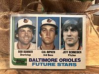 Front side of 1982 Topps Baltimore Orioles Future Stars baseball card showing headshots of Bob Bonner, Cal Ripken Jr, and Jeff Schneider.