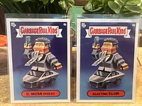 Pair of Garbage Pail Kids Elon Musk parody cards 4a Electric Elon and 4b U. Musk Invest together.