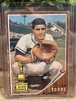 Front view of 1962 Topps Joe Torre rookie baseball card showing player in Milwaukee Braves uniform and All-Star Rookie trophy emblem.