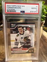 Front view of the 2023 Topps Now NHL Connor Bedard rookie card graded PSA 10 in protective case.
