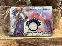 Front of the card shows Vince Carter in Raptors uniform and embedded piece of game-worn shirt.