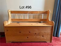 Front view of wooden bench with backrest and storage lid in closed position