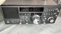 Full front view of Yaesu FRG-7700 receiver on grey cloth surface