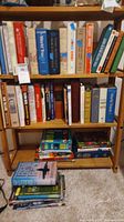 Wooden bookshelf filled with various books