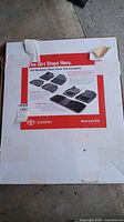 Box top showing the label and image of Toyota all-weather floor liner set with product details and features.