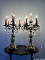 Front view of both candelabra unlit showing overall design and scale