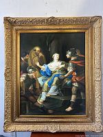 Full front view of gilt wood frame and canvas depicting Lucretia lamenting with soldiers and figure in background
