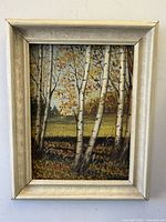 Front view of the framed oil painting depicting birch trees in an autumn landscape.
