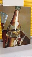 Printed canvas art with Cristal champagne bottle and a glass, showing reflections and gold foil details.