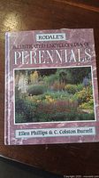 Cover of 'Rodale's Illustrated Encyclopedia of Perennials' showing a garden photo and the authors' names