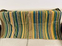 Full view of the vintage Mexican horse blanket showing the colorful striped pattern and size.