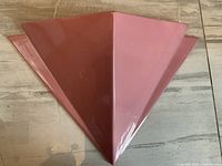 Top-down image showing the fan-shaped large ceramic wall pocket with a glossy pink finish.