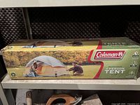 Box of Coleman Mountain Vista 4 person tent showing outdoor camping scene and branding.