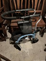 Full view of Evolution Espresso Walker showing structure, padded handlebars, wheels and storage area