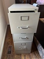 Filing cabinet showing full front view with all three drawers and handles.