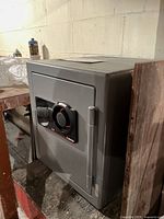 Photo of the Sentry 3100 safe showing front closed door with combination dial lock and handle.