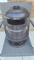 Front view of the Dynatrap XL mosquito trap showing the main body and mesh trapping grid.