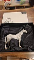 Porcelain horse figurine inside satin-lined Royal Doulton box