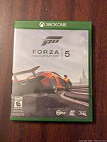 Front cover of Forza Motorsport 5 Xbox One game case showing racing car artwork and Xbox One branding.