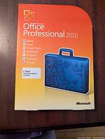 Front view of the Microsoft Office Professional 2010 software box with the list of applications included.