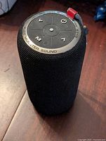 Front/top view of black Monster portable Bluetooth speaker showing control buttons