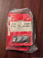 Front view of the Bulldog picture hanger set unopened in plastic packaging showing quantity, brand and weight capacity