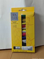 Front view of yellow box containing 10 tubes of Winsor & Newton Galeria Acrylic Paint, 12 ml each.