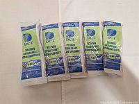 Five packages of DCT descaler sachets lined up side by side, showing the front packaging with brand and product information.