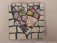 Full view of 5.5 inch square mosaic with broken crockery pieces arranged in heart design.