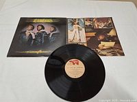 Vinyl record with album cover and inner photo sleeve showing the Bee Gees album Children of the World