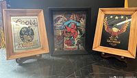 Three framed vintage mirrored and hologram signs: Coors, Spider-Man, Harley Davidson on stands