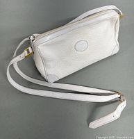 Front right angle view showing bag shape, leather texture, strap attachment