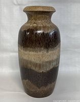 Front view of large brown and beige Scheurich ceramic vase showing cylindrical body and flared rim