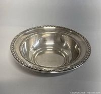 Front view of the vintage Alvin sterling silver bowl showing decorative border and smooth interior surface.