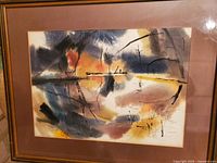 Framed abstract watercolor painting with muted colors and black line details