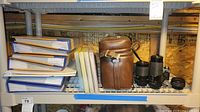 Shelf view: Kodak photo albums, camera bag, zoom lens, teleconverter