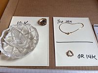 Overview showing 10K class ring on glass stand, gold-filled bracelet and heart pendant