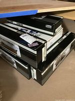 Stack of four black and white K-Line Classic Steel train car boxes