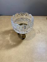 Top view of the crystal rose bowl votive showing clear cut glass patterns and scalloped edges.