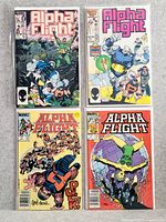 Four Alpha Flight comic books displayed together, all with colorful illustrated covers showing superhero characters in action poses.